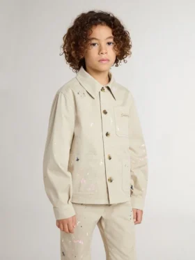Beigefarbene Kinderjacke mit bunten Farbtupfern