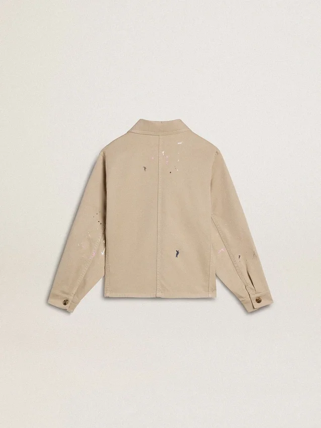 Beigefarbene Kinderjacke mit bunten Farbtupfern