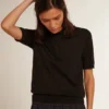 Damen-Poloshirt aus schwarzer Merinowolle
