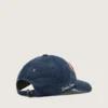 Denimblaue Baseballkappe mit rot-weißem „Golden“-Aufnäher aus Frottee