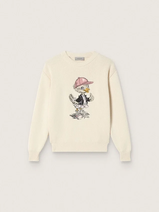 Goldfarbener Mädchenpullover aus weißem Baumwollgarn mit Maskottchen-Stickerei