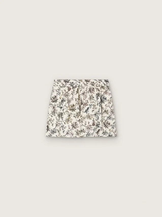 „Journey“-Minirock für Mädchen aus weißem Baumwoll-Canvas mit grünem Blumenprint