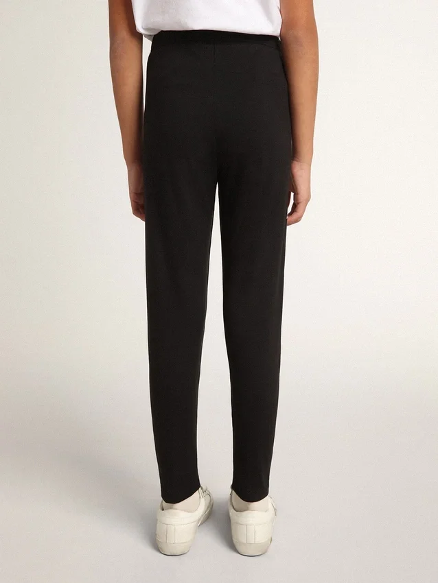 Schwarze Leggings für Mädchen mit weißen Sternen an den Seiten