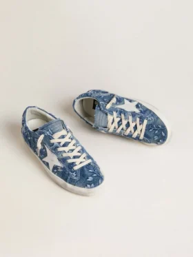 Super-Star LTD für Damen in hellblauem Denim mit weißem Lederstern und gestickten Blumen