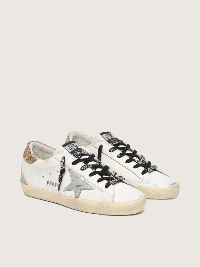 Weiße Super-Star-Damenschuhe aus Leder mit glitzernder Fersenlasche