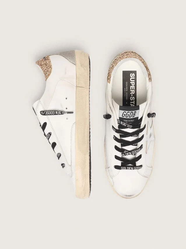 Weiße Super-Star-Damenschuhe aus Leder mit glitzernder Fersenlasche