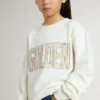 Weißes Mädchen-Sweatshirt mit mehrfarbigem goldenem Schriftzug auf der Vorderseite